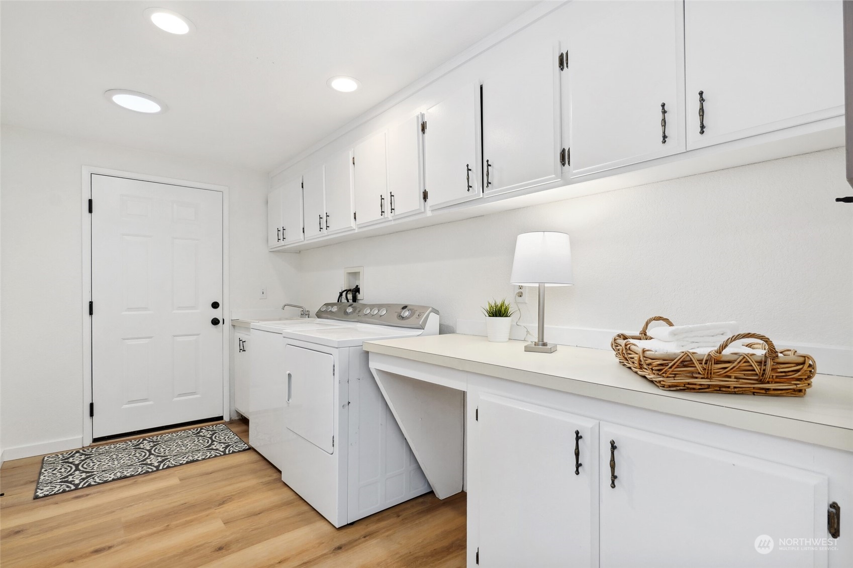 24113 10th Place West Bothell, WA 98021 - Photo 28 of 35 a kitchen with white cabinets and sink