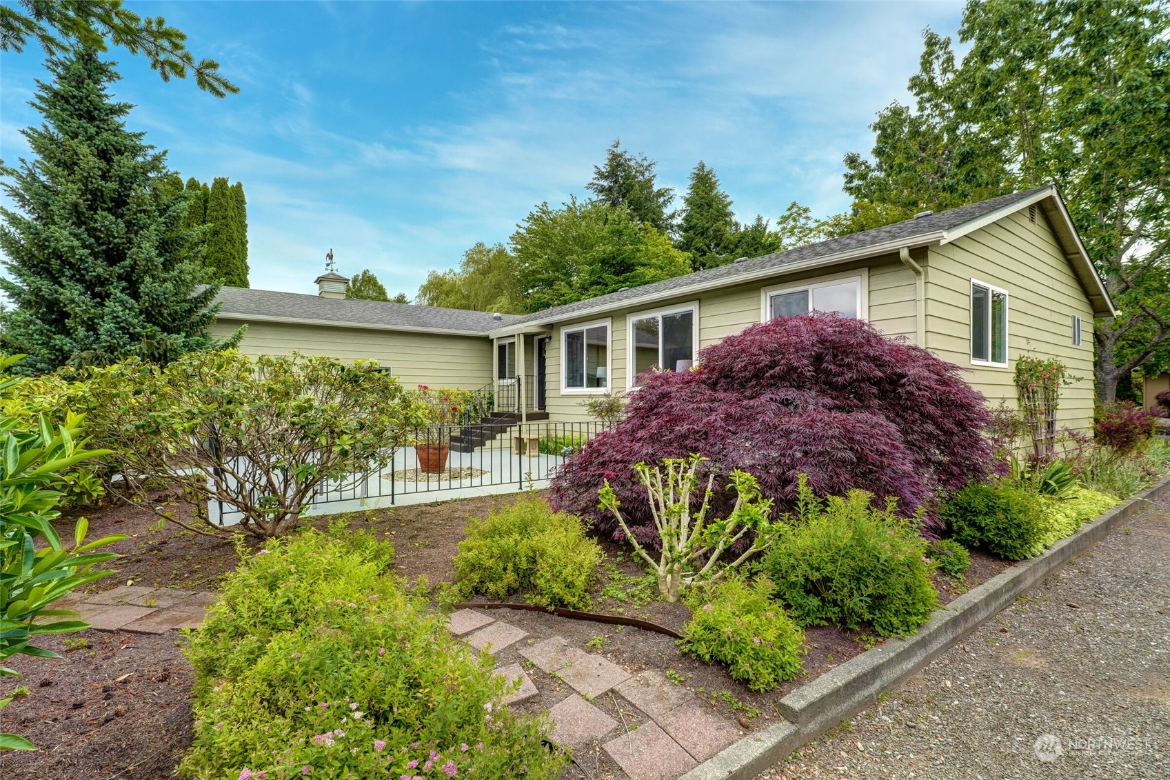 24113 10th Place West Bothell, WA 98021 - Photo 5 of 35 a view of a house with a big yard and potted plants