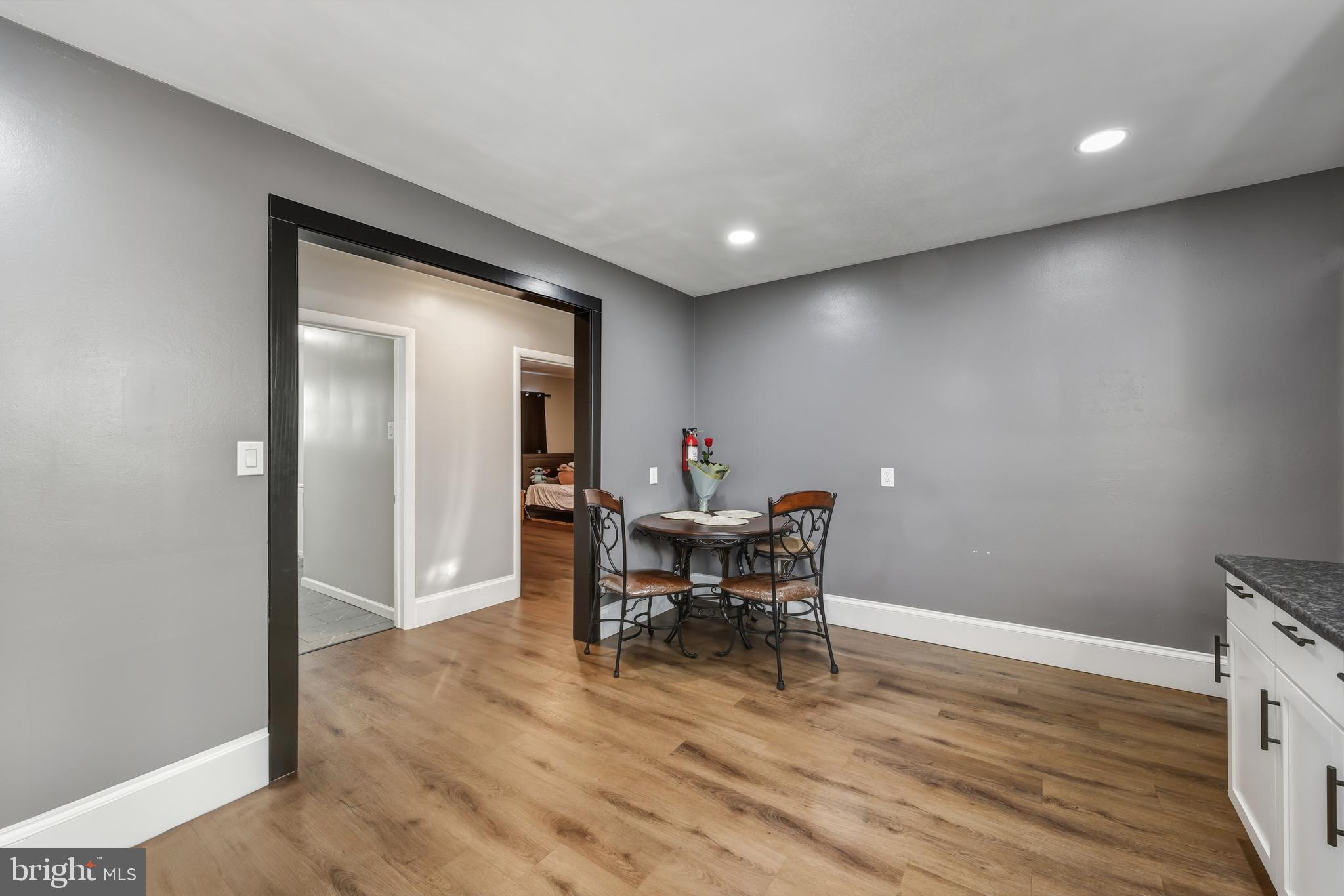 114 Magnolia Avenue Bridgeton, NJ 08302 - Photo 12 of 30 a workspace with furniture and wooden floor