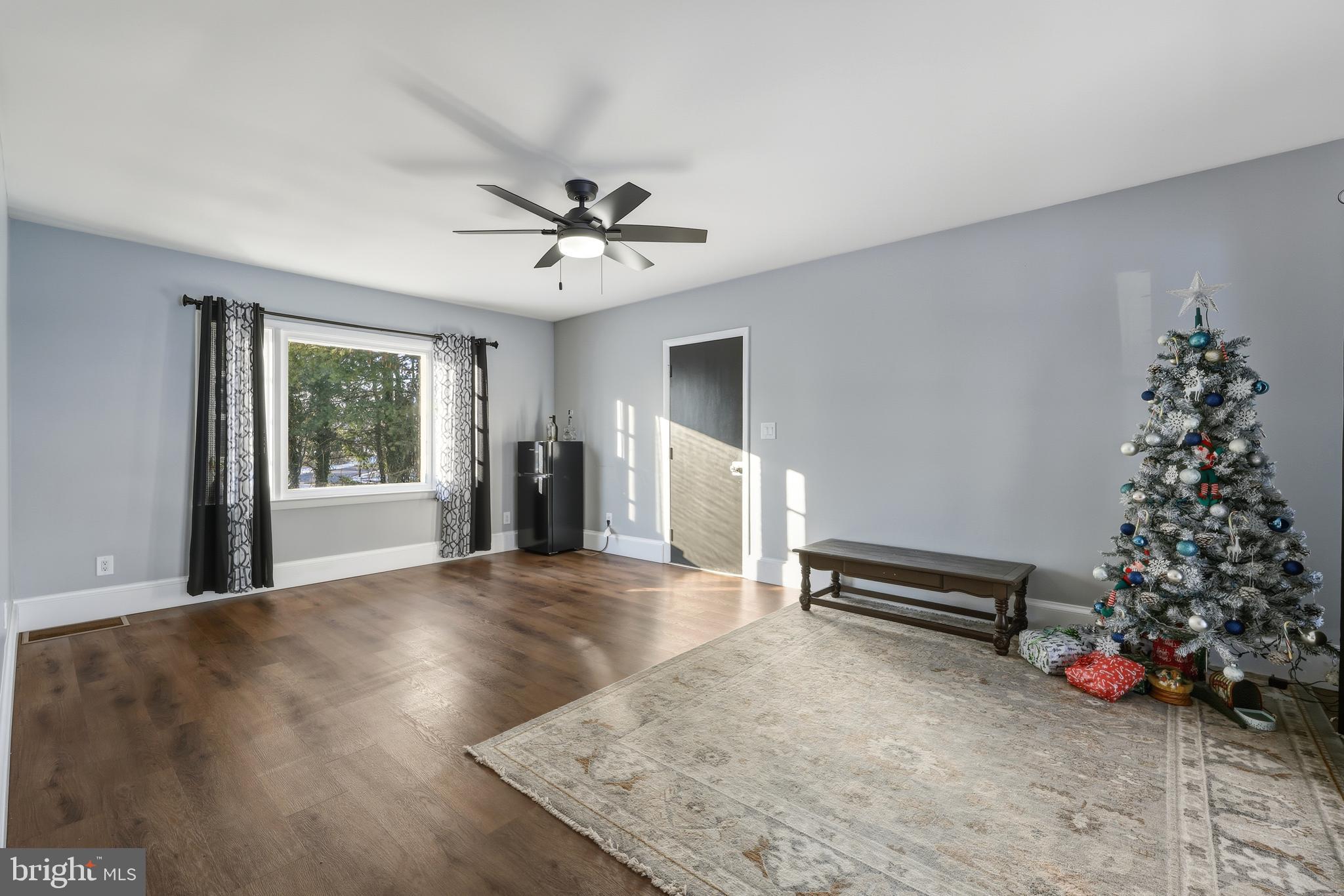 114 Magnolia Avenue Bridgeton, NJ 08302 - Photo 4 of 30 a view of an empty room with window and chandelier fan
