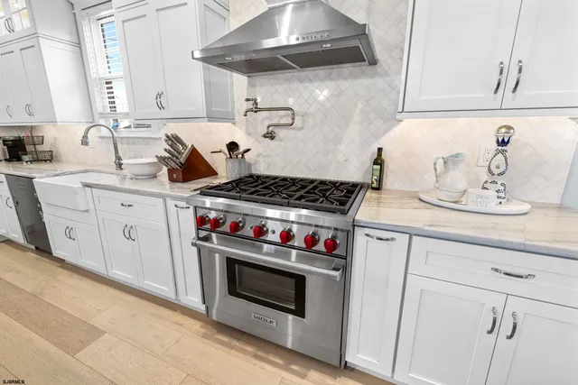 a large kitchen with lots of counter space and seating area