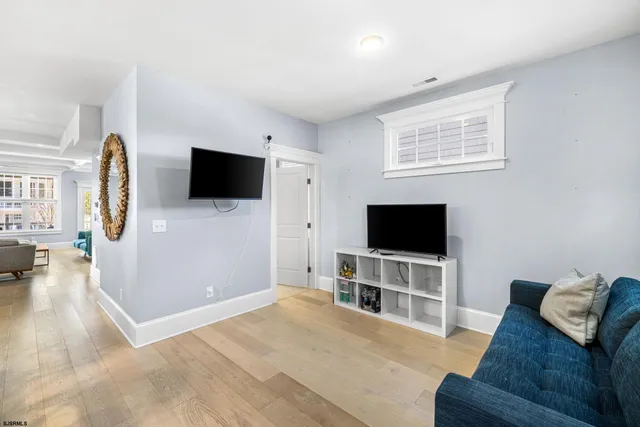 a bathroom with a toilet a sink and a mirror