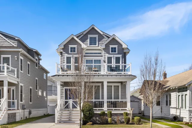 a front view of a residential apartment building with a yard