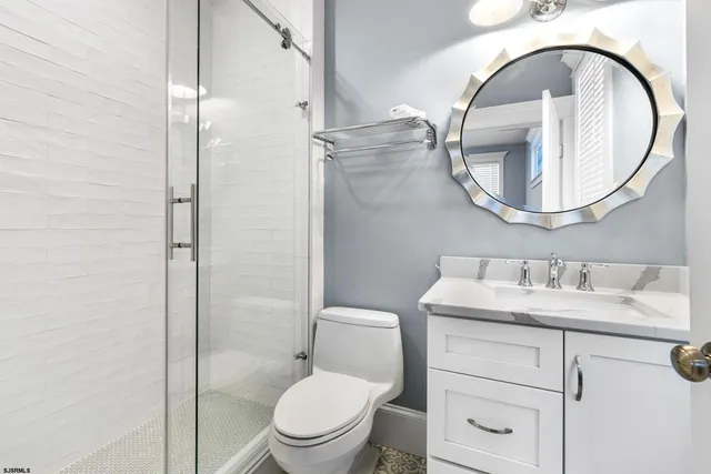 a view of a hallway with a white walls and stairs
