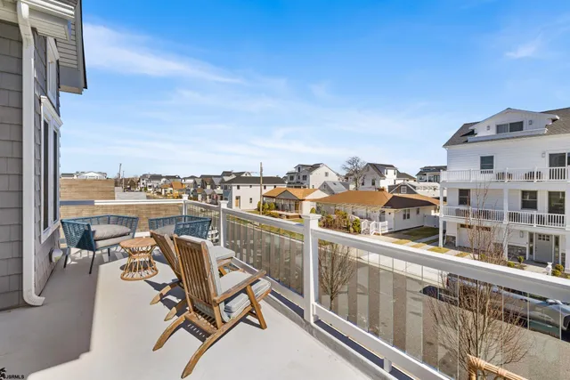 a spacious bedroom with a large bed and a flat screen tv