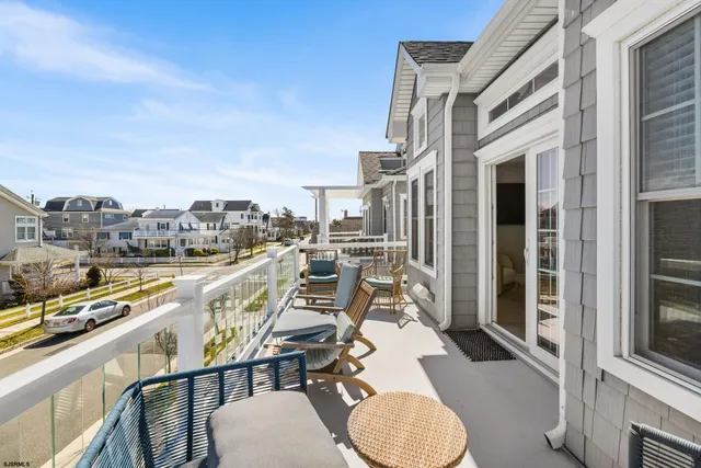 a spacious bedroom with a bed and wooden floor