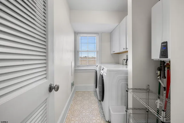 a bedroom with furniture and a flat screen tv
