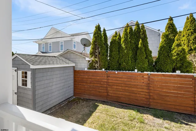 a aerial view of a house with sitting area