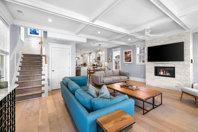 a living room with fireplace furniture and a flat screen tv