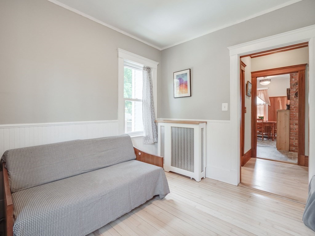 81 Baker Street Boston, MA 02132 - Photo 13 of 42 a living room with a couch and a window