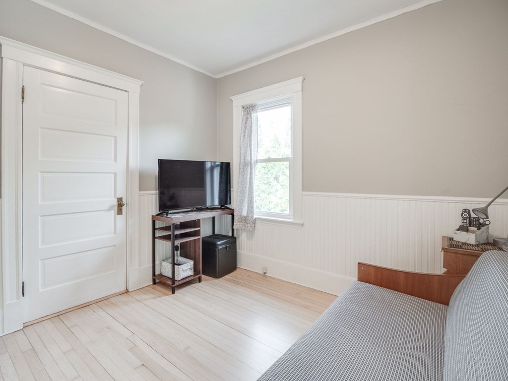 81 Baker Street Boston, MA 02132 - Photo 14 of 42 a bedroom with furniture and flat screen tv