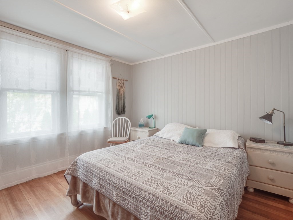 81 Baker Street Boston, MA 02132 - Photo 20 of 42 a bedroom with a bed and a window