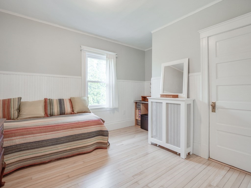 81 Baker Street Boston, MA 02132 - Photo 24 of 42 a bedroom with a bed and a window