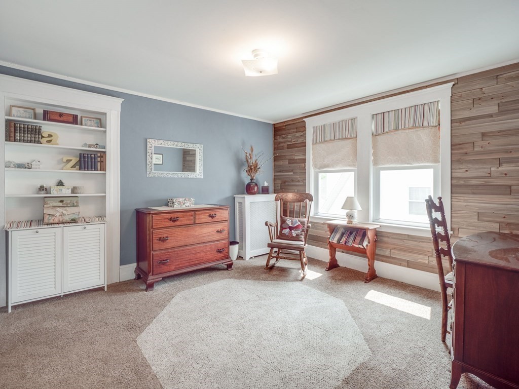 81 Baker Street Boston, MA 02132 - Photo 25 of 42 a bedroom with furniture and a window