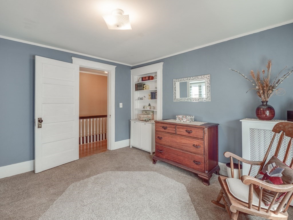 81 Baker Street Boston, MA 02132 - Photo 26 of 42 a view of a bedroom with furniture window and wooden floor