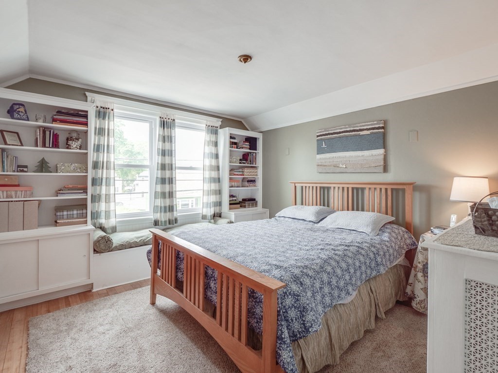 81 Baker Street Boston, MA 02132 - Photo 27 of 42 a bed room with a bed and a window