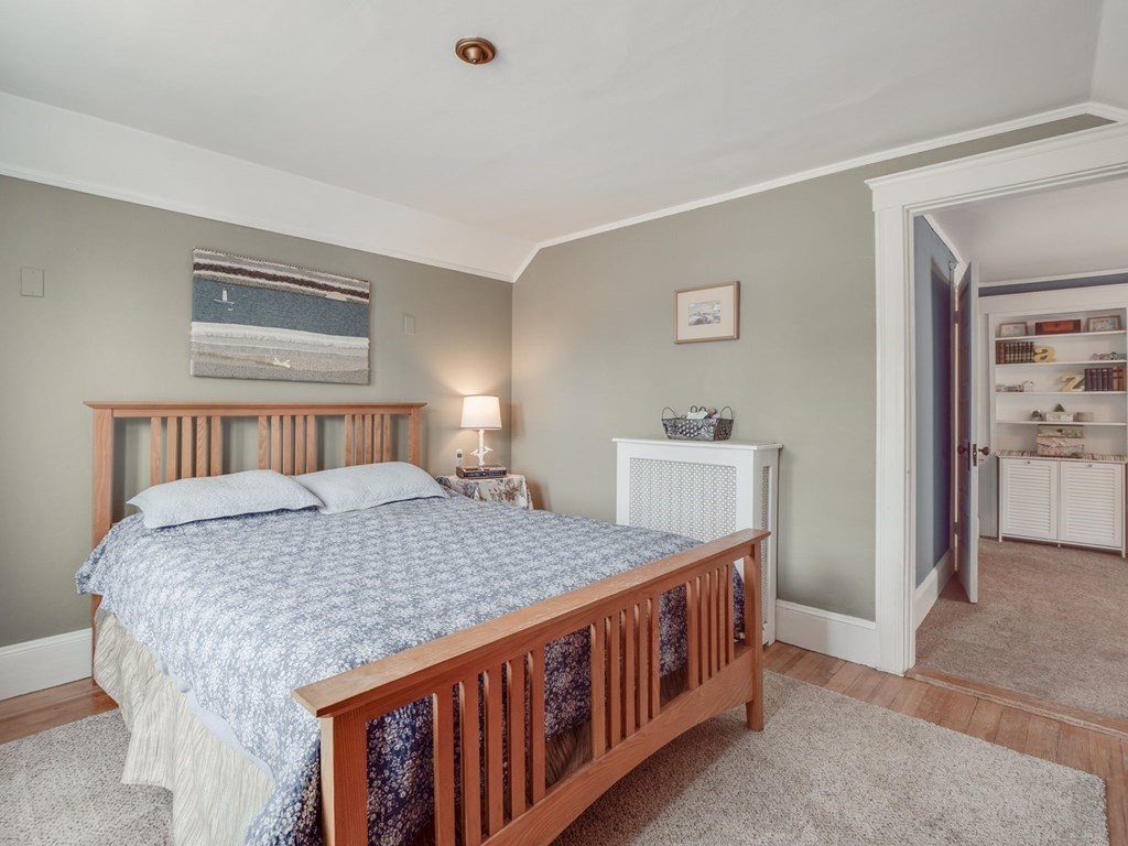 81 Baker Street Boston, MA 02132 - Photo 28 of 42 a bedroom with a bed and a baby crib