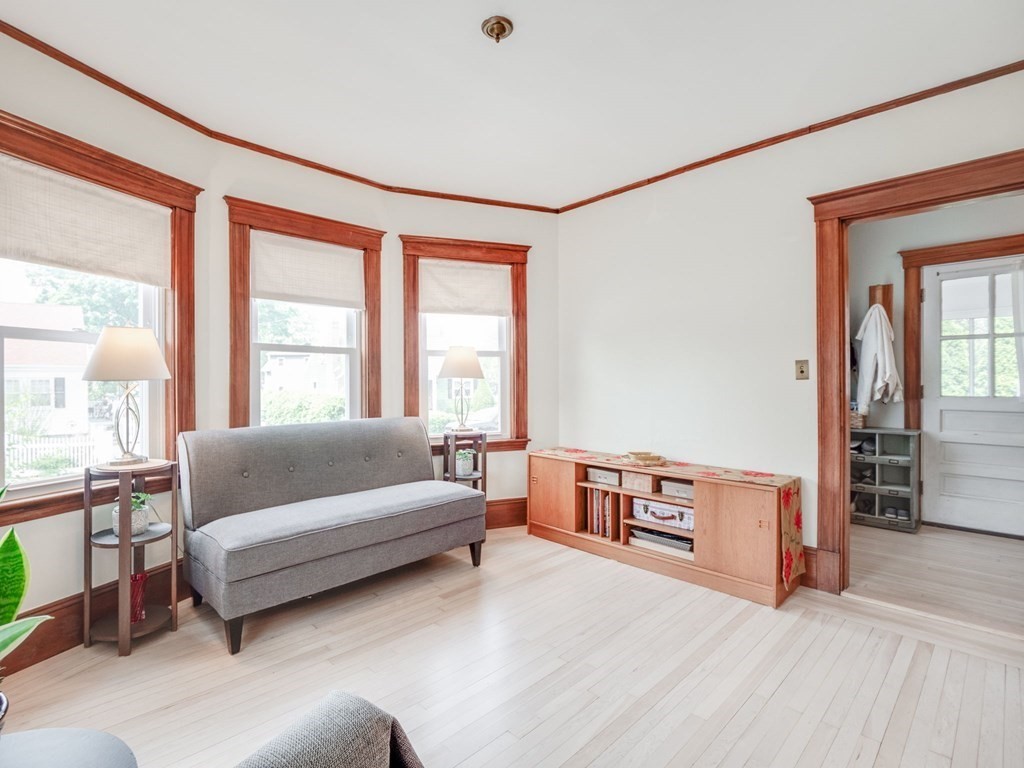 81 Baker Street Boston, MA 02132 - Photo 3 of 42 a living room with furniture and a large window
