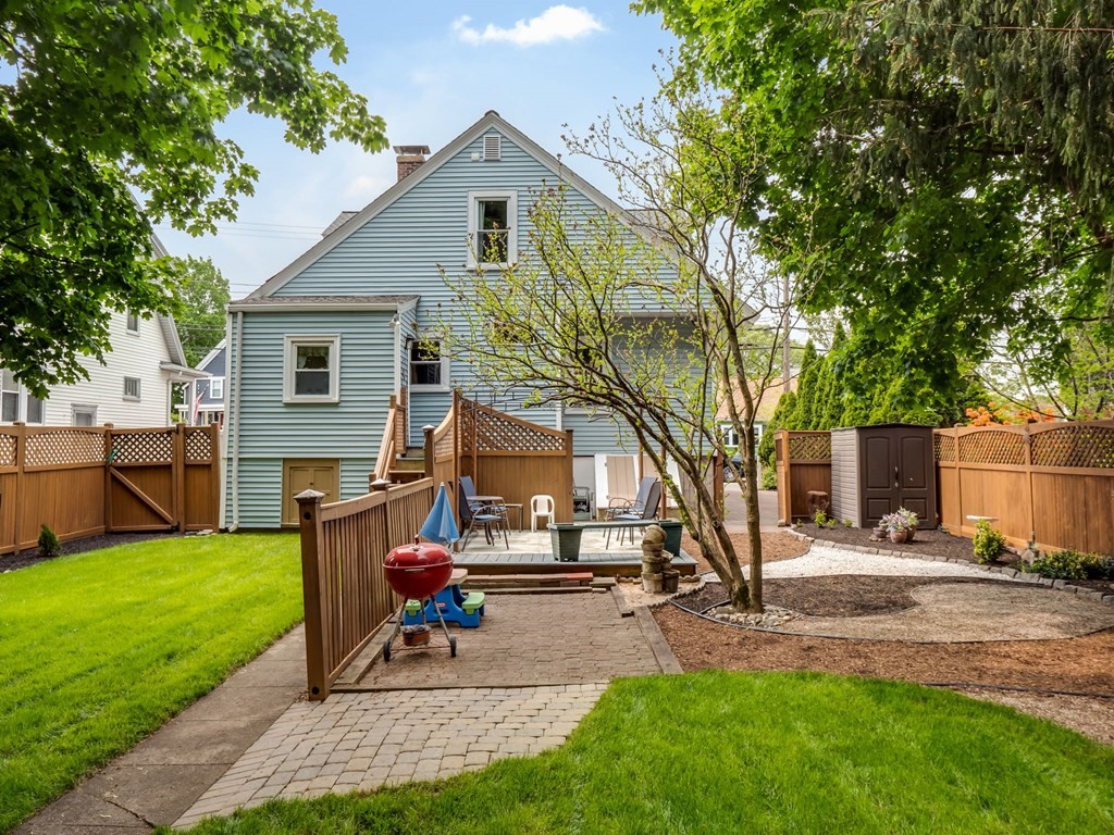 81 Baker Street Boston, MA 02132 - Photo 36 of 42 a view of a house with backyard and a tree