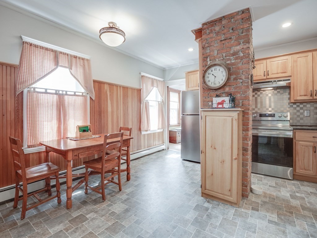 81 Baker Street Boston, MA 02132 - Photo 9 of 42 a view of a dining room with furniture window and wooden floor