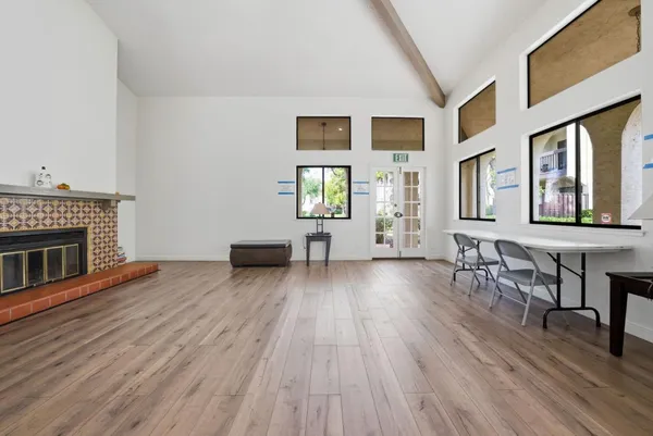 a kitchen with a sink and a wooden floor