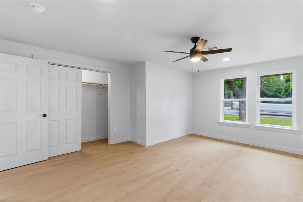 507 Country Club Road Cleburne, TX 76033 - Photo 21 of 39 Light wood-finish flooring complements white walls and trim