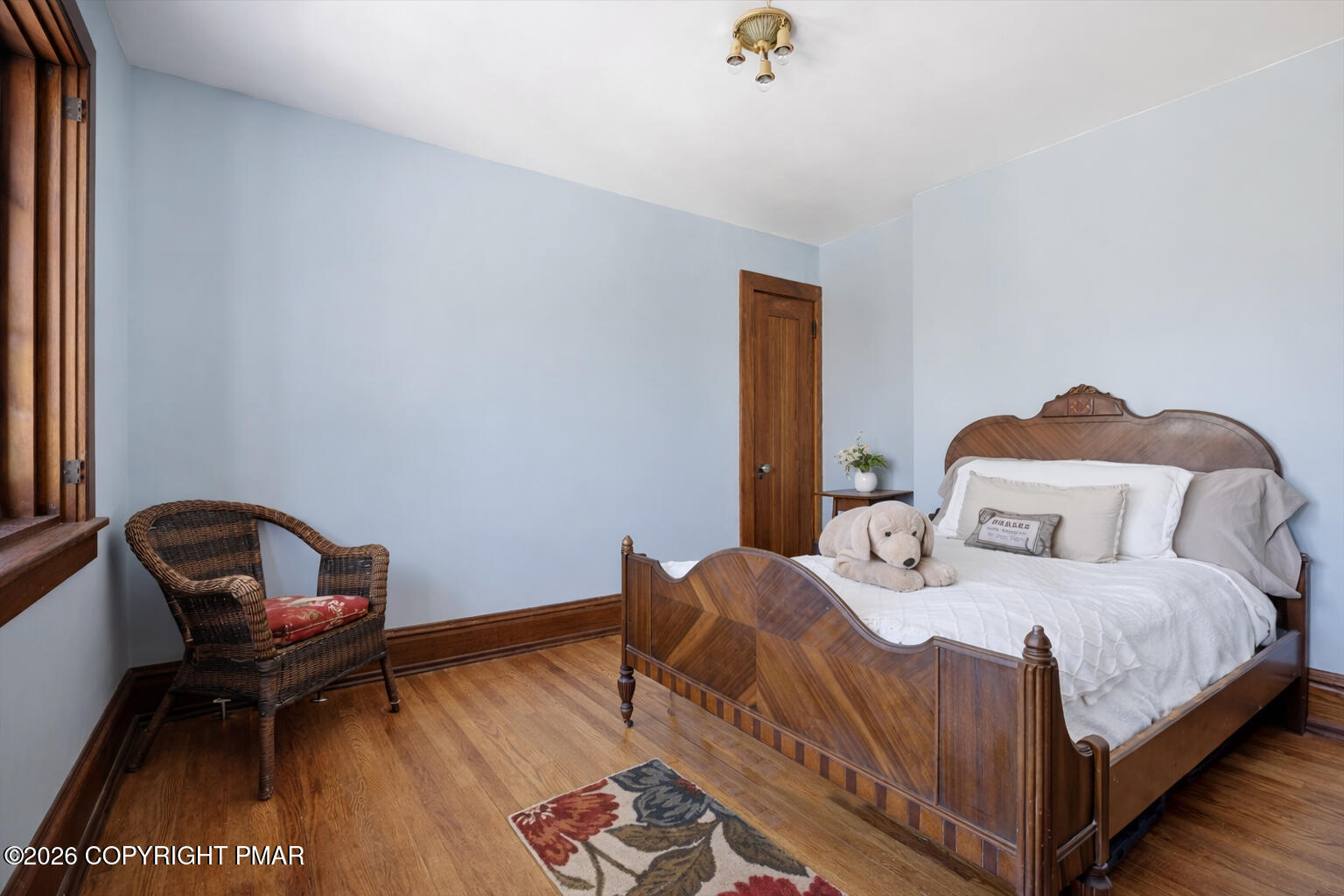 204 Lake Road Swiftwater, PA 18370 - Photo 51 of 76 a bedroom with a bed chair and wooden floor