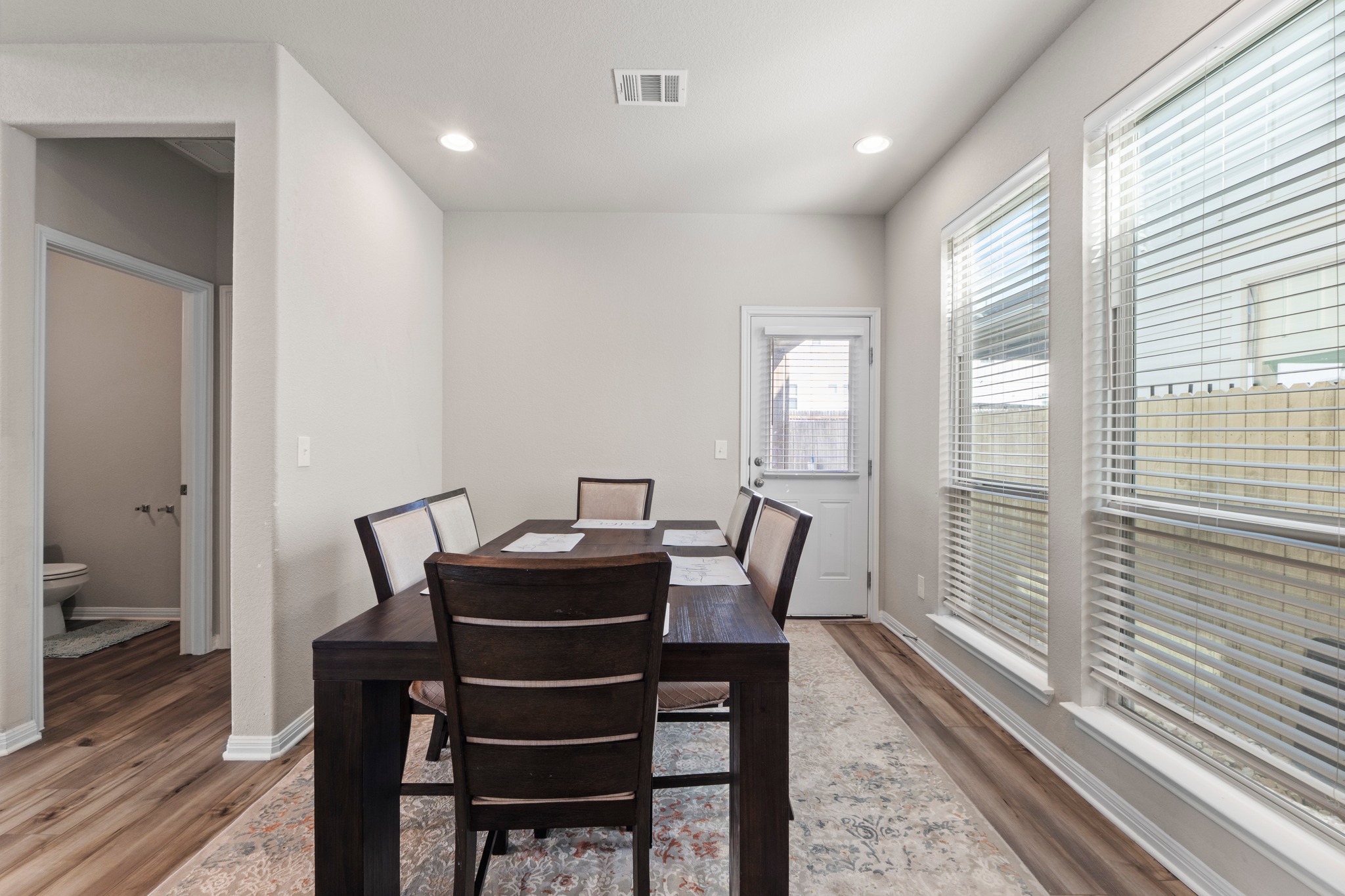 159 MacArthur Drive Leander, TX 78641 - Photo 12 of 31 a view of a dining room with furniture window and wooden floor