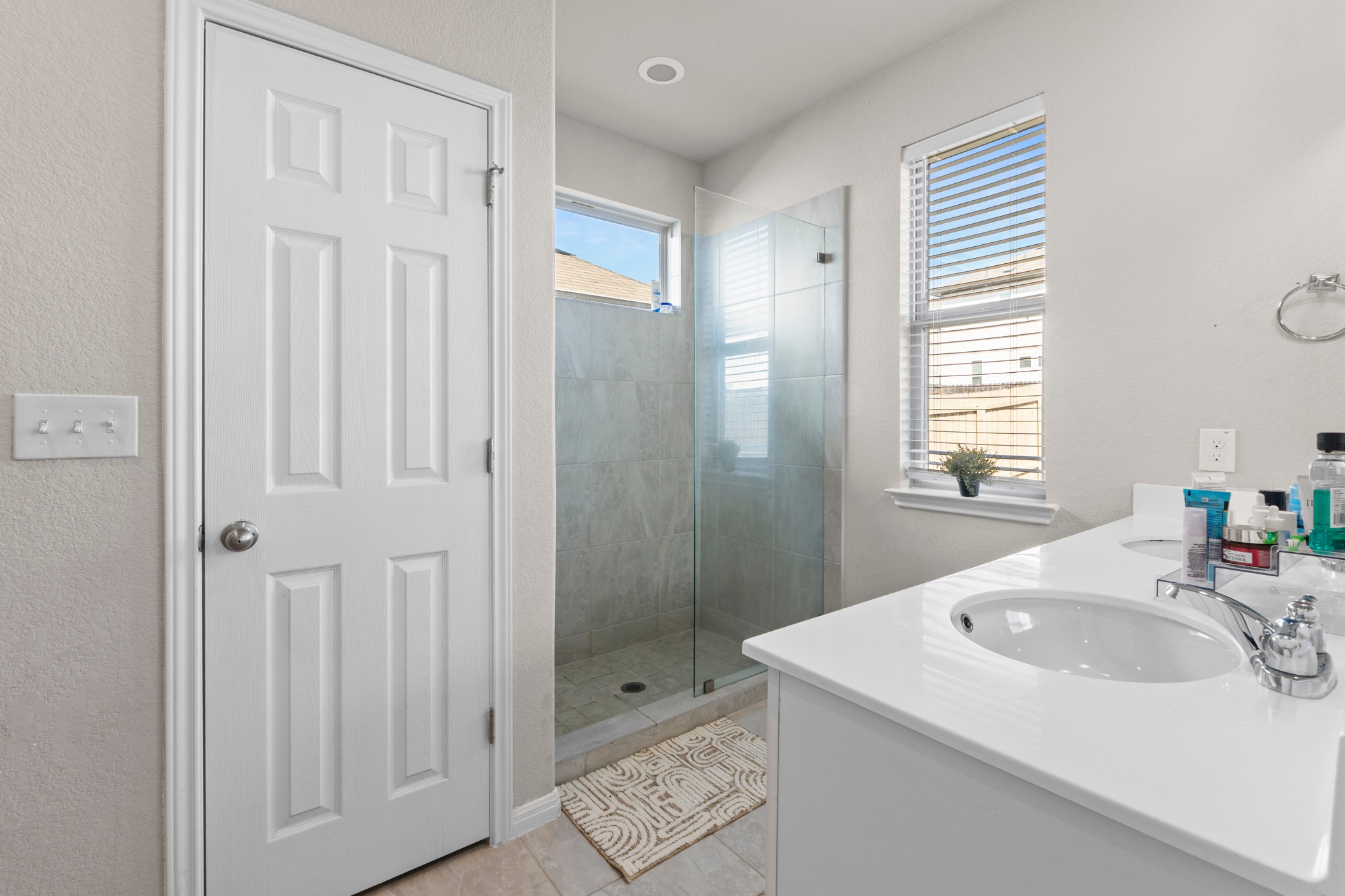 159 MacArthur Drive Leander, TX 78641 - Photo 16 of 31 a bathroom with a sink shower and a mirror