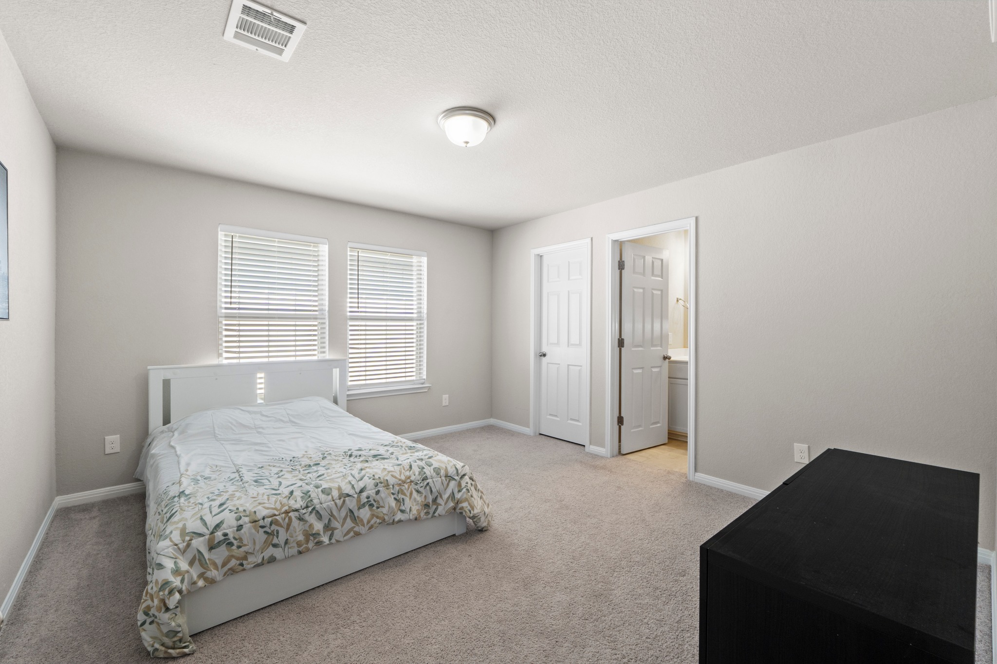 159 MacArthur Drive Leander, TX 78641 - Photo 21 of 31 a bedroom with a bed and a closet