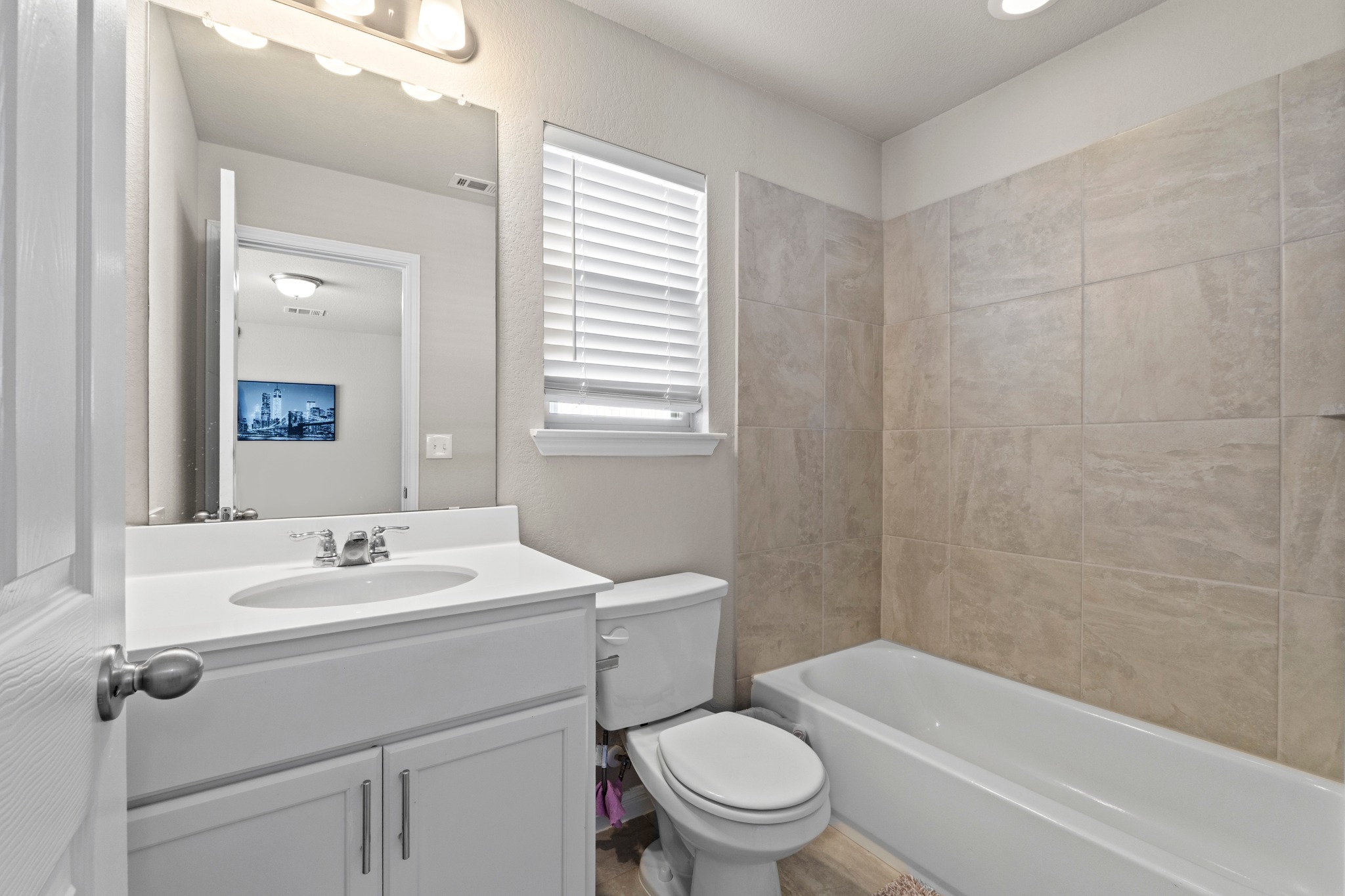 159 MacArthur Drive Leander, TX 78641 - Photo 22 of 31 a bathroom with a sink a toilet and shower