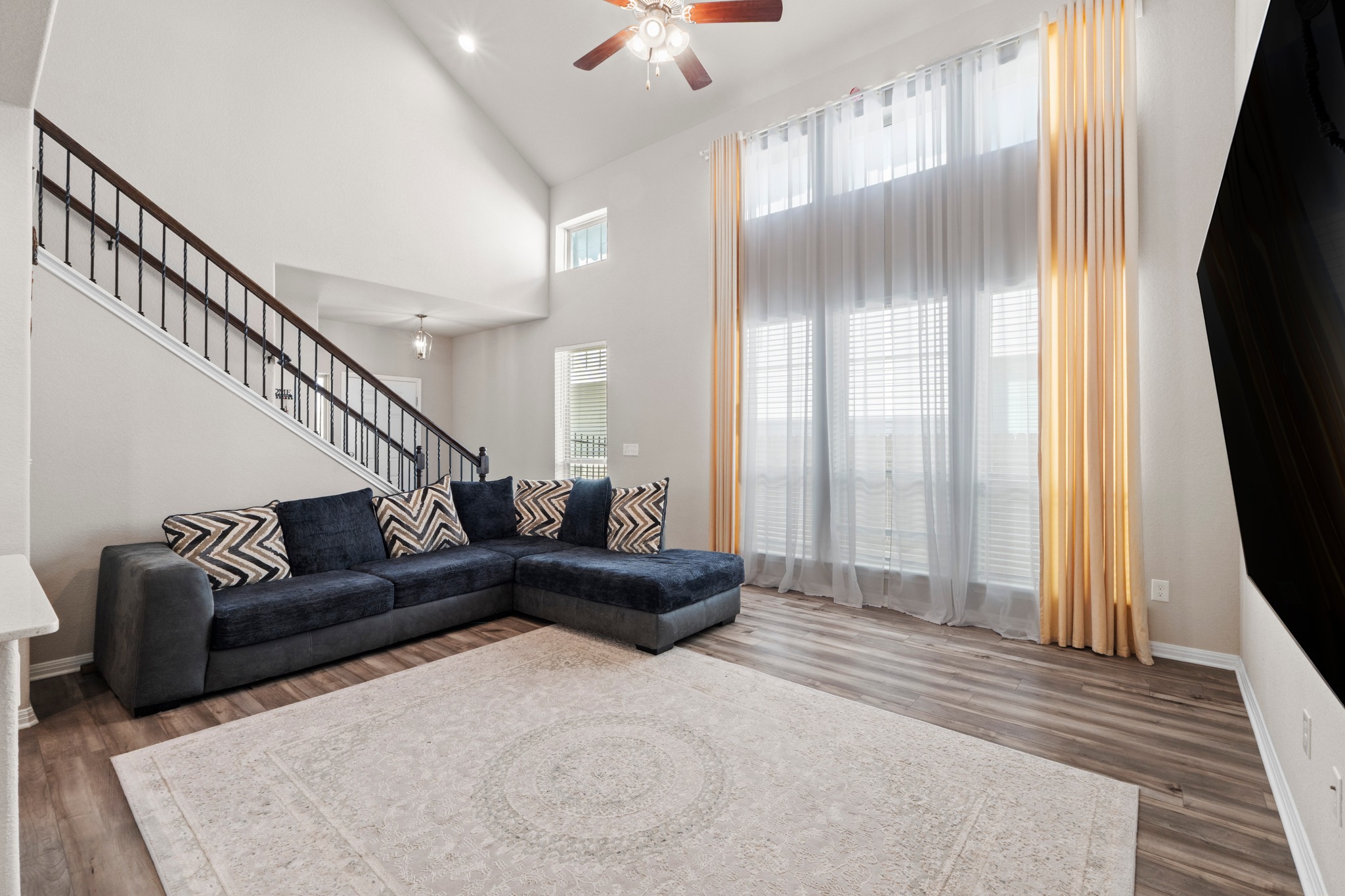 159 MacArthur Drive Leander, TX 78641 - Photo 7 of 31 a living room with furniture and a flat screen tv