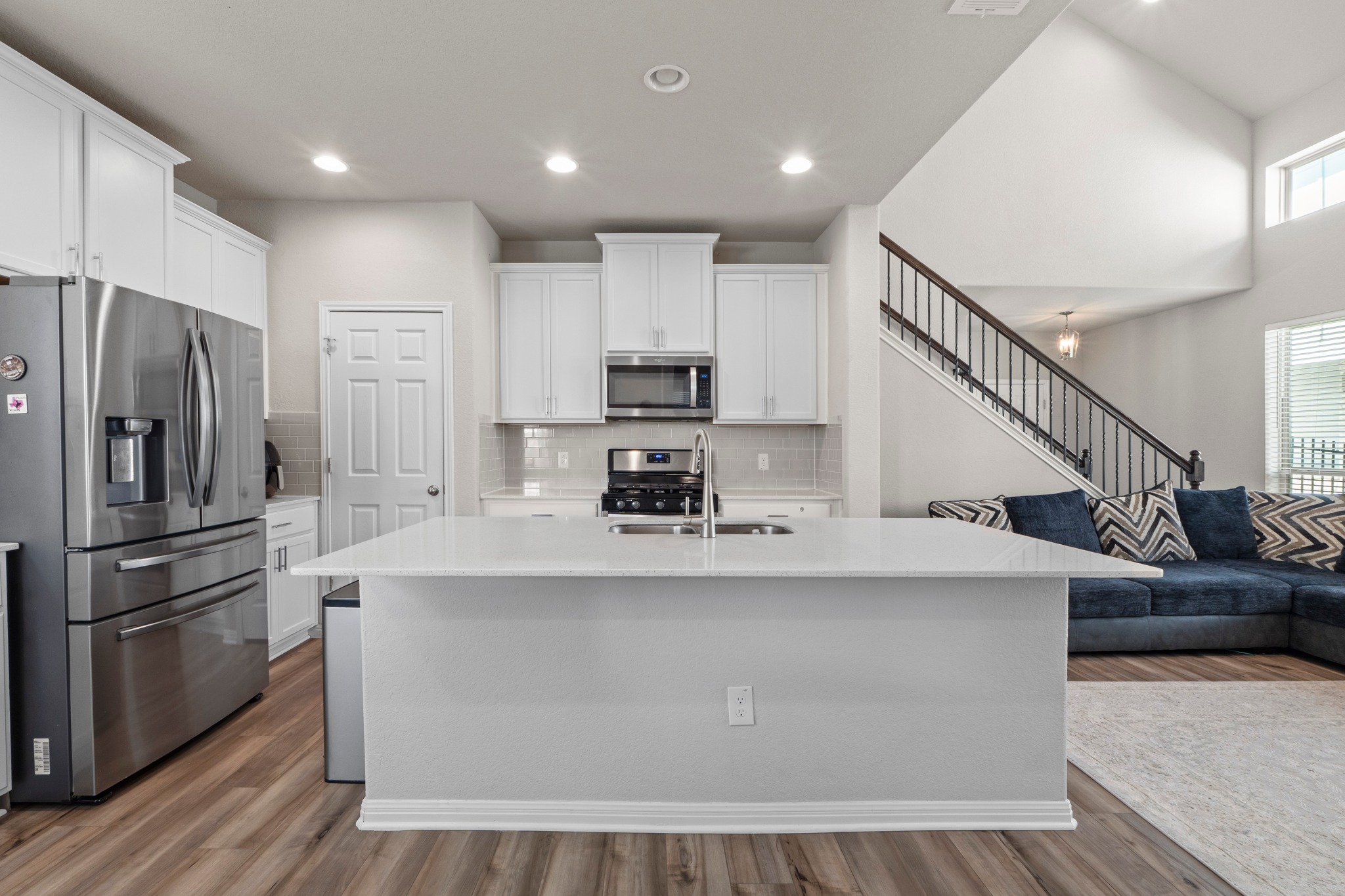 159 MacArthur Drive Leander, TX 78641 - Photo 31 of 31 a kitchen with kitchen island a counter top space stainless steel appliances and cabinets