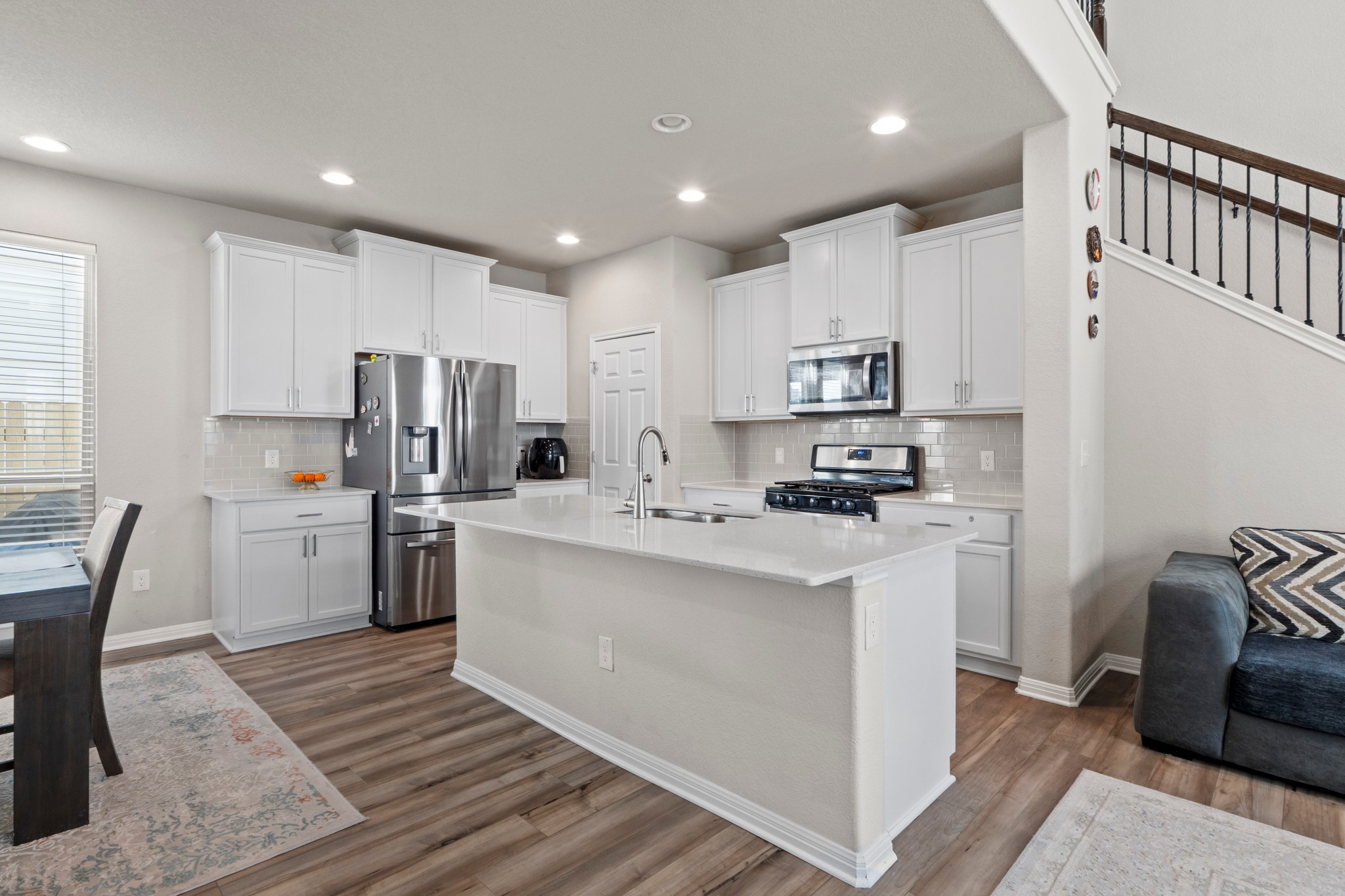 159 MacArthur Drive Leander, TX 78641 - Photo 8 of 31 a kitchen with refrigerator and cabinets