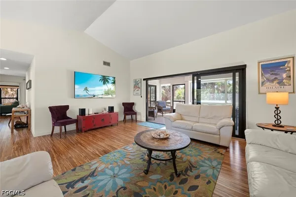 a living room with furniture and a table