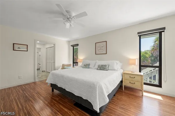 a spacious bedroom with a bed and a large window