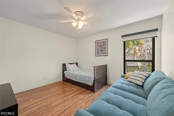 a bedroom with furniture and a window