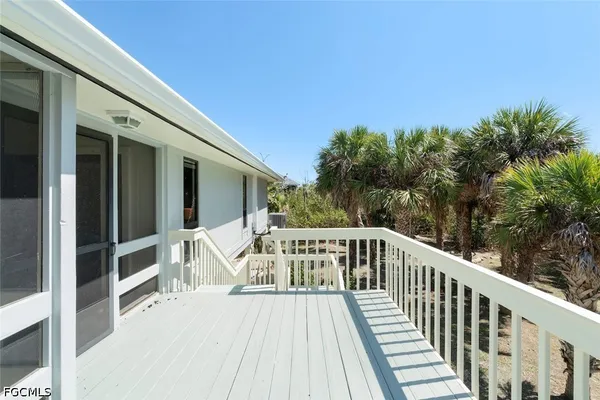 a view of balcony with deck and wooden floor