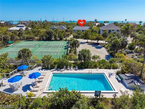 a view of yard with swimming pool and outdoor seating