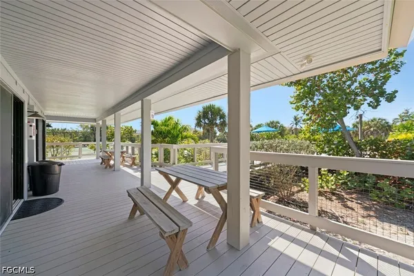 a view of a patio with wooden floor
