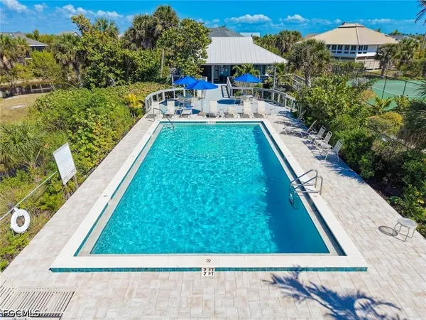 a view of swimming pool with chairs