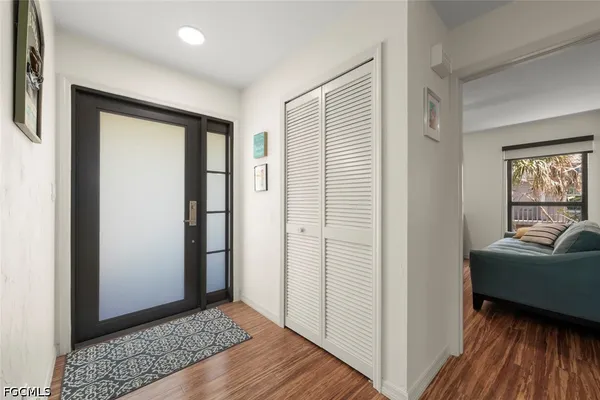 a view of a livingroom with furniture and windows