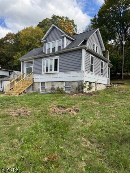 382 Howard Boulevard Mount Arlington, NJ 07856 - Photo 1 of 23 a front view of a house with a yard