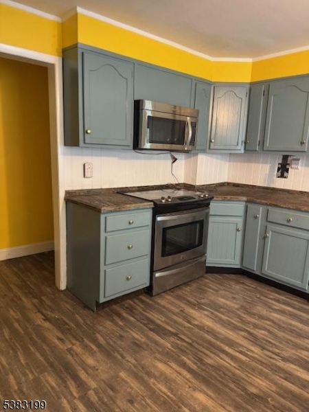 382 Howard Boulevard Mount Arlington, NJ 07856 - Photo 18 of 23 a kitchen with stainless steel appliances granite countertop a stove a sink and a microwave