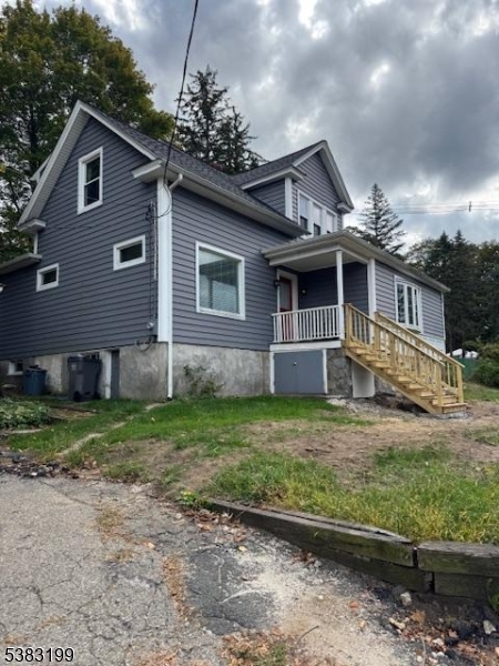 382 Howard Boulevard Mount Arlington, NJ 07856 - Photo 2 of 23 a front view of a house with garden