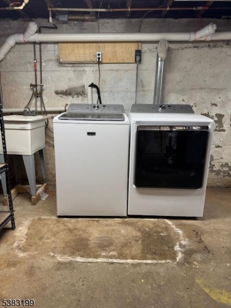 382 Howard Boulevard Mount Arlington, NJ 07856 - Photo 23 of 23 a utility room with a stove top oven and cabinets