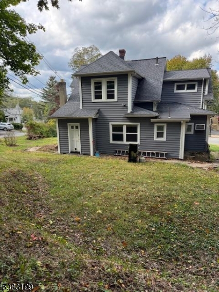 382 Howard Boulevard Mount Arlington, NJ 07856 - Photo 3 of 23 a front view of a house with a yard