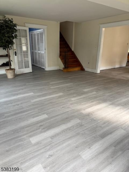 382 Howard Boulevard Mount Arlington, NJ 07856 - Photo 5 of 23 an empty room with wooden floor and windows