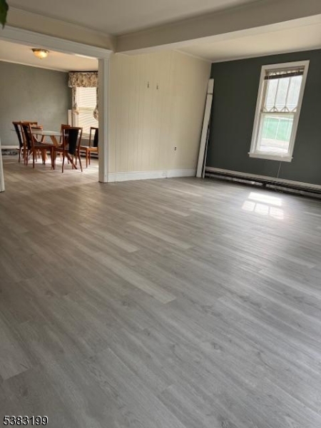 382 Howard Boulevard Mount Arlington, NJ 07856 - Photo 7 of 23 an empty room with wooden floor and windows