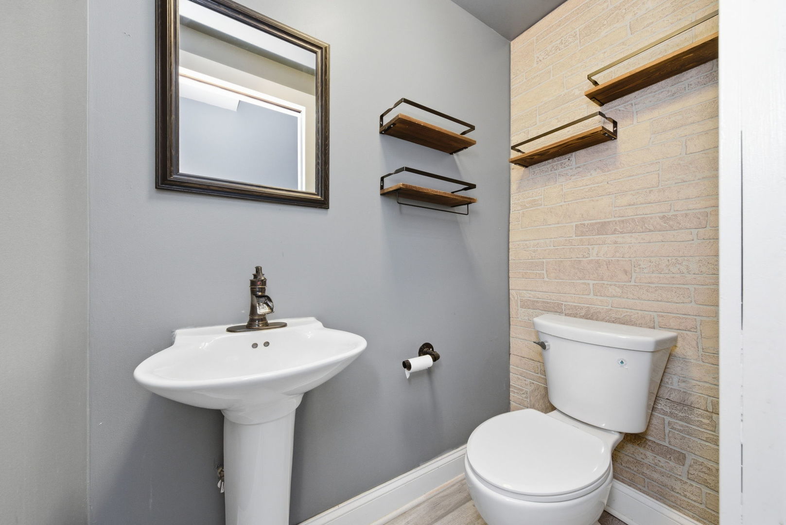 500 Catherine Street Ottawa, IL 61350 - Photo 11 of 23 a bathroom with a toilet sink and mirror